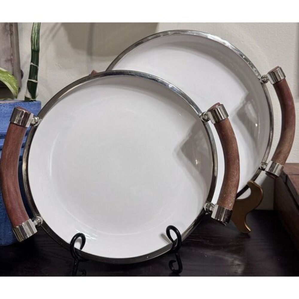 Set Of Two White Ceramic Salad Trys With Wooden Handles And Chrome Rims.